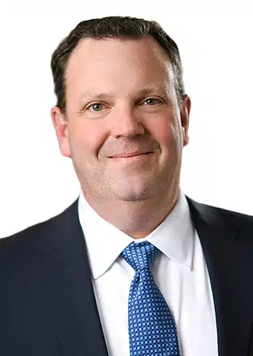 Ryan Raschke chief financial officer RAYUS Radiology man with brown hair in black suit jacket and blue tie